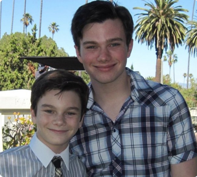  Chris Colfer as Curt and Adam Kolkin as Young Kurt Hummel