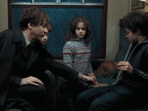 Remus Lupin giving Harry the chocolate