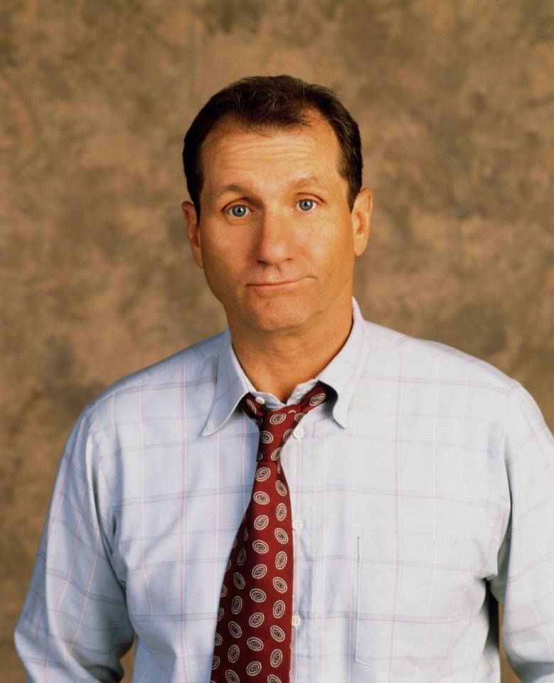 Ed O'Neill as his TV show role of Al Bundy 