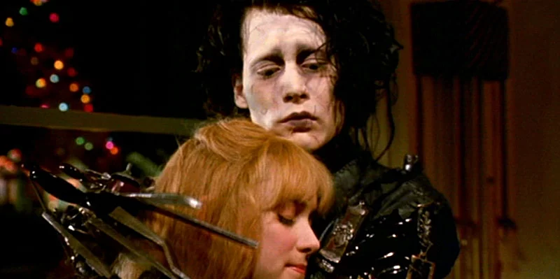 Edward Scissorhands hugging Kim.