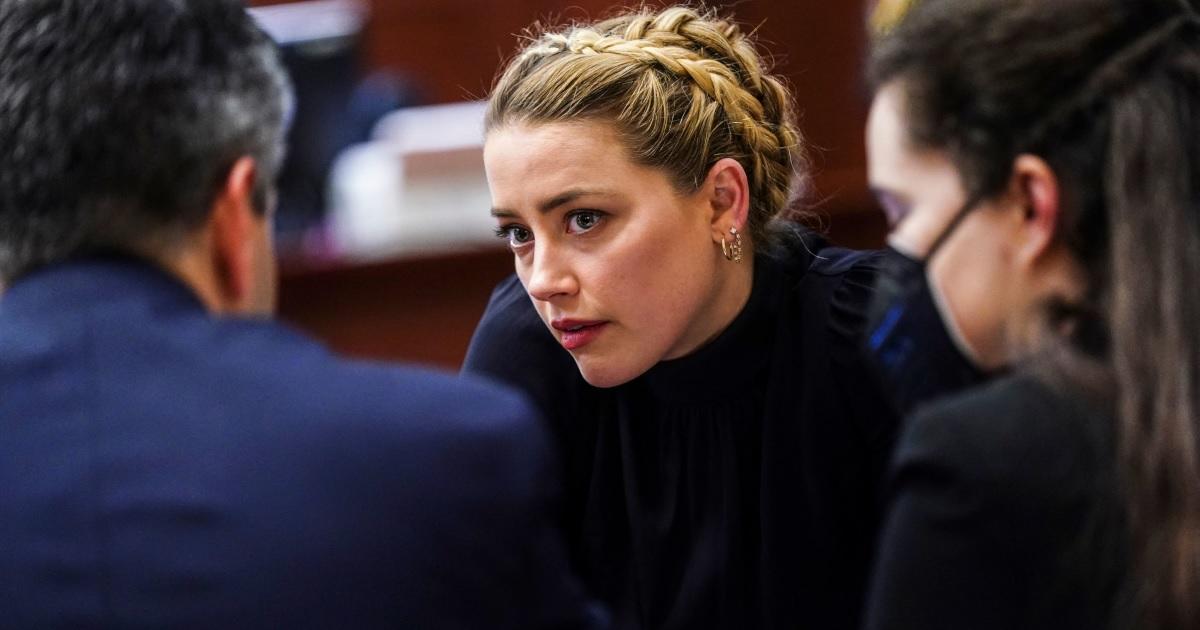 Amber Heard in talks with legal team.