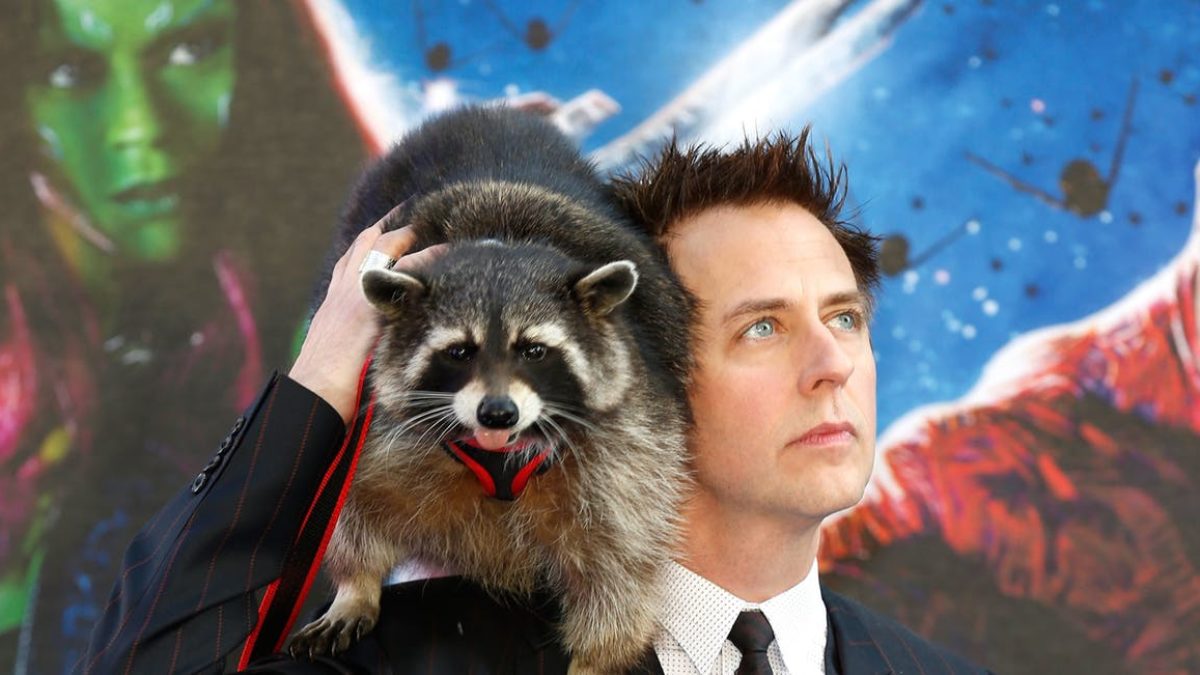 James Gunn holding a prototype of Rocket Raccoon.