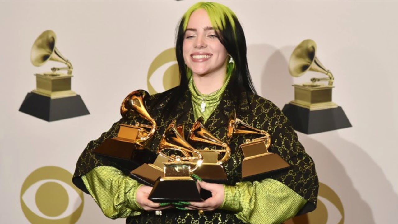 Billie Eilish with her grammy awards