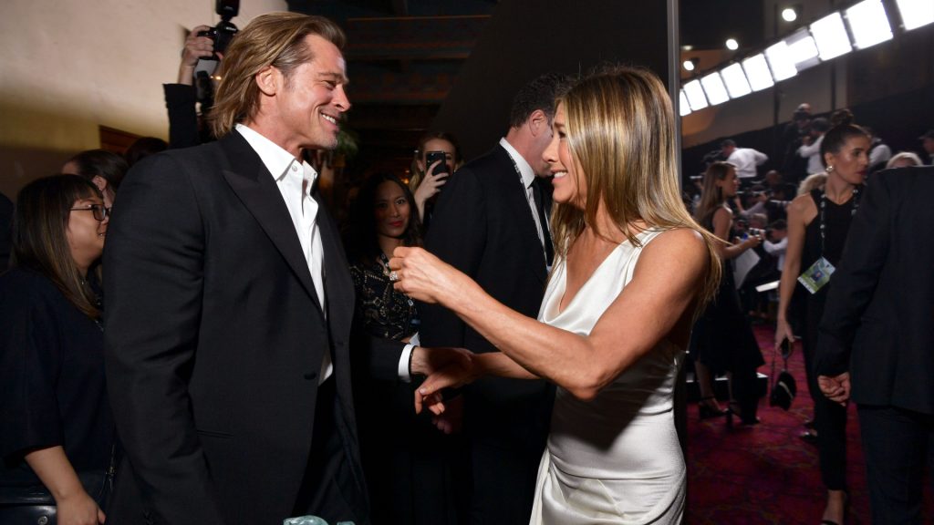 Brad Pitt and Jennifer Aniston reuniting at an event.